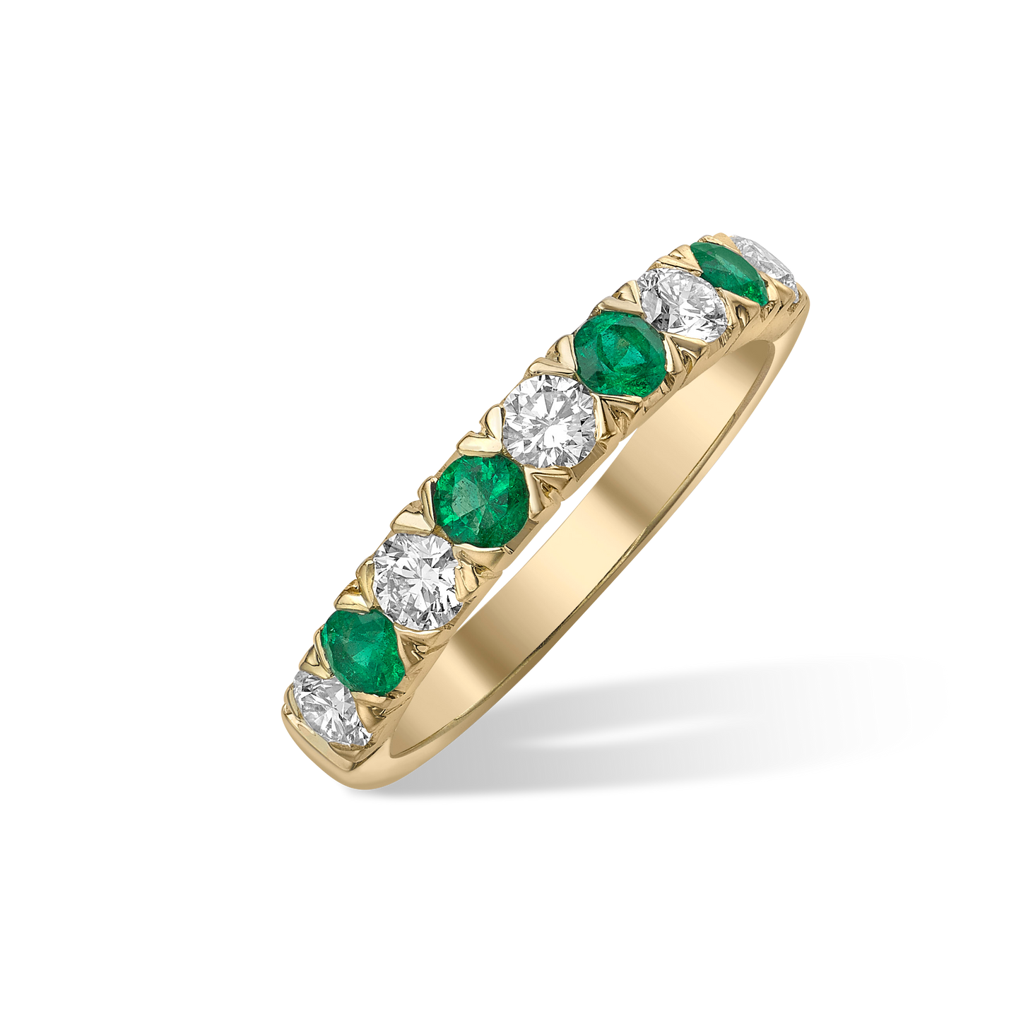 Emerald and diamond half eternity ring